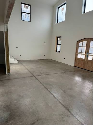 Sealed interior concrete floor with saw-cut joints in a great room by Kuphal Concrete
